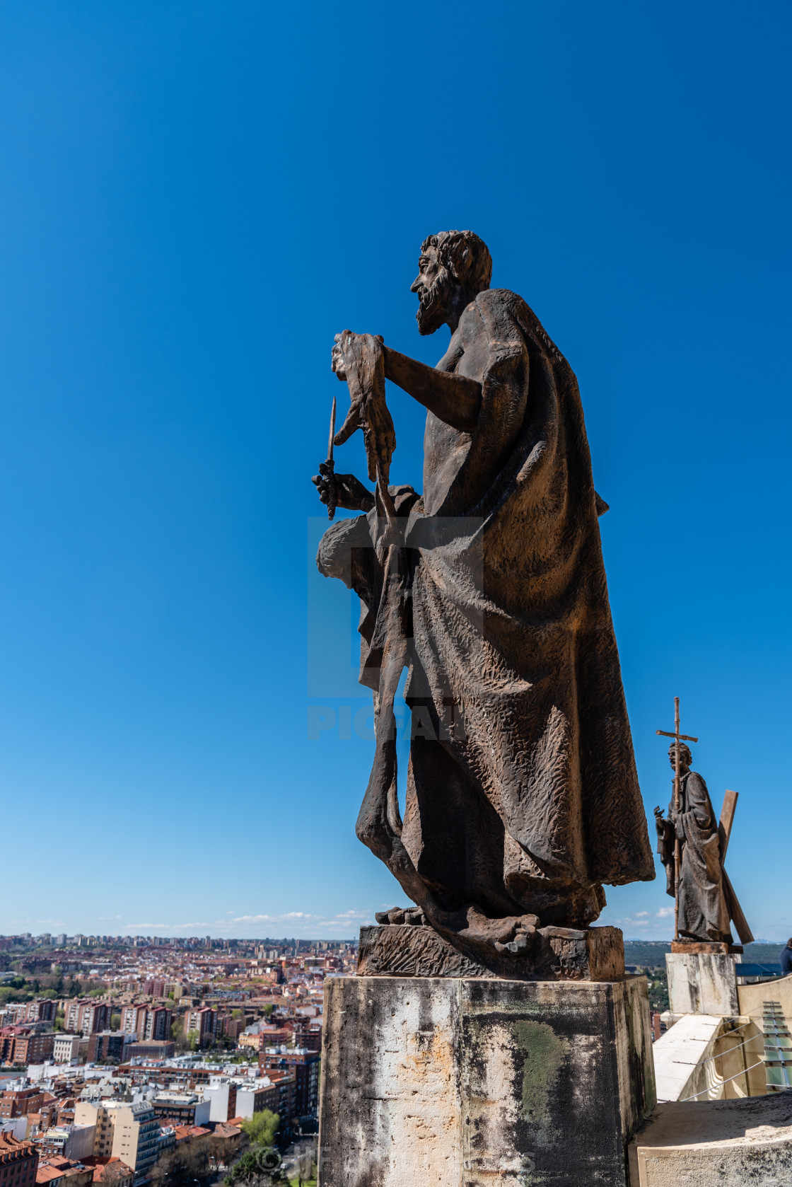 "Bronze sculpture of apostle at the rooftop of Almudena Catheral in Madrid" stock image