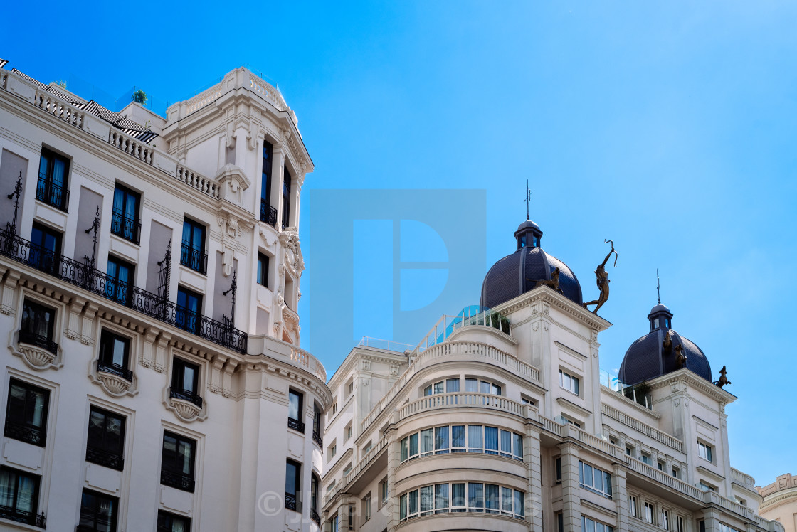 "Historic residential buildings in Gran Via Avenue in Madrid" stock image