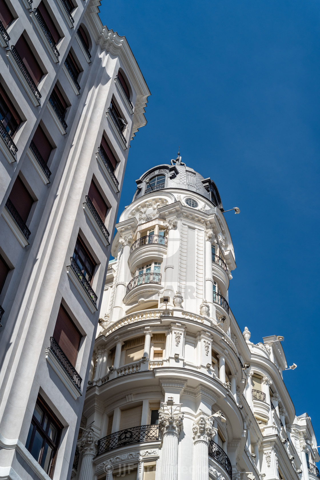 "Historic residential buildings in Gran Via Avenue in Madrid" stock image