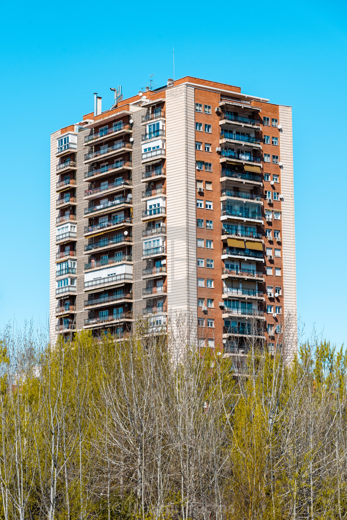 "Apartment Building against blue sky in Madrid, Spain" stock image