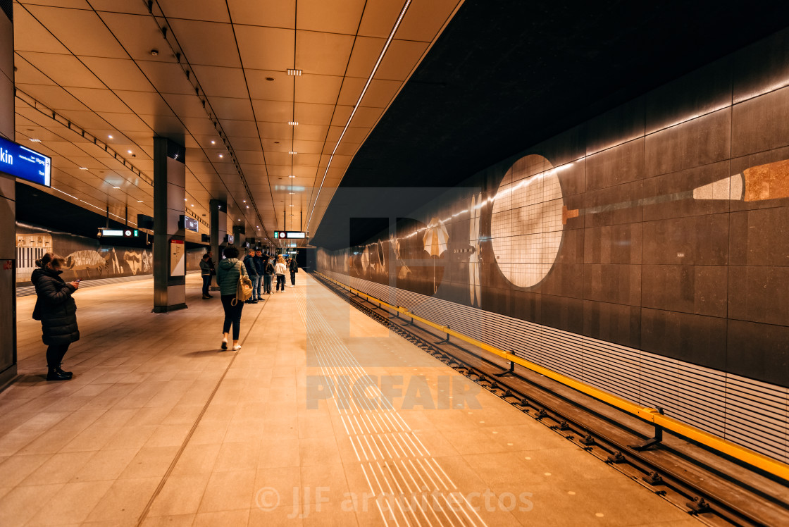 "Underground station in central Amsterdam. View of the platform with passengers" stock image