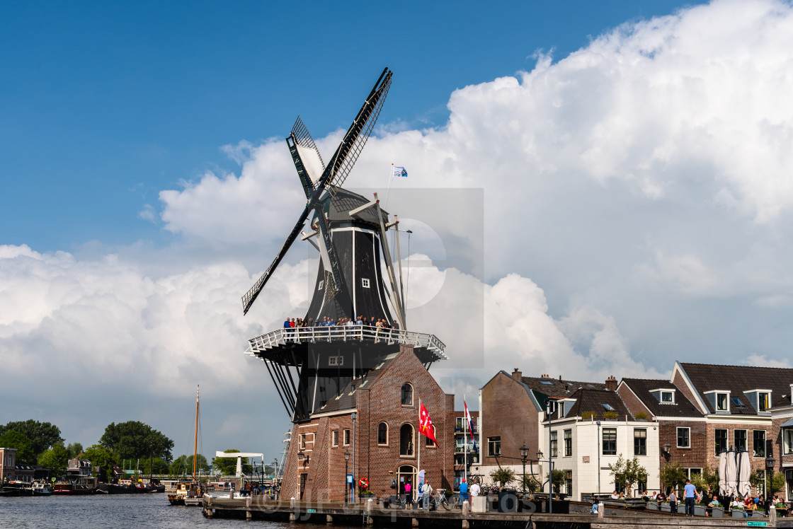 "Famous Windmill De Adriaan by the Spaarne River in Haarlem" stock image