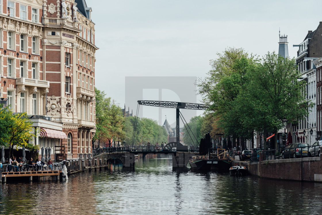 "Aluminium Bridge in Kloveniersburgwal canal in central Amsterdam" stock image