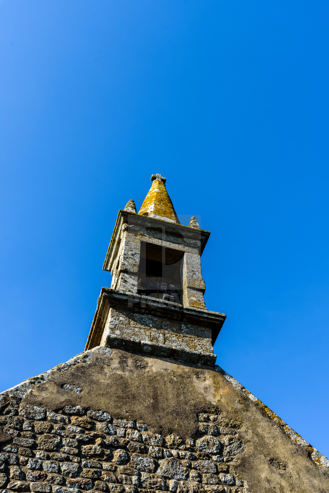 "The tower of the old church of Saint-Cado in Brittany" stock image