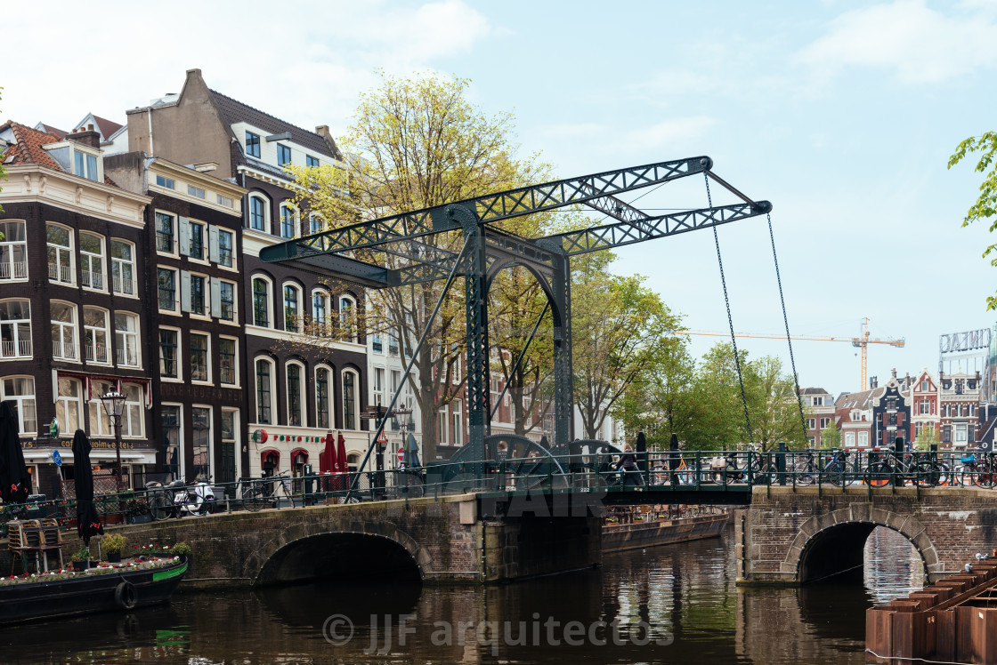 "Aluminium Bridge in Kloveniersburgwal canal in central Amsterdam" stock image