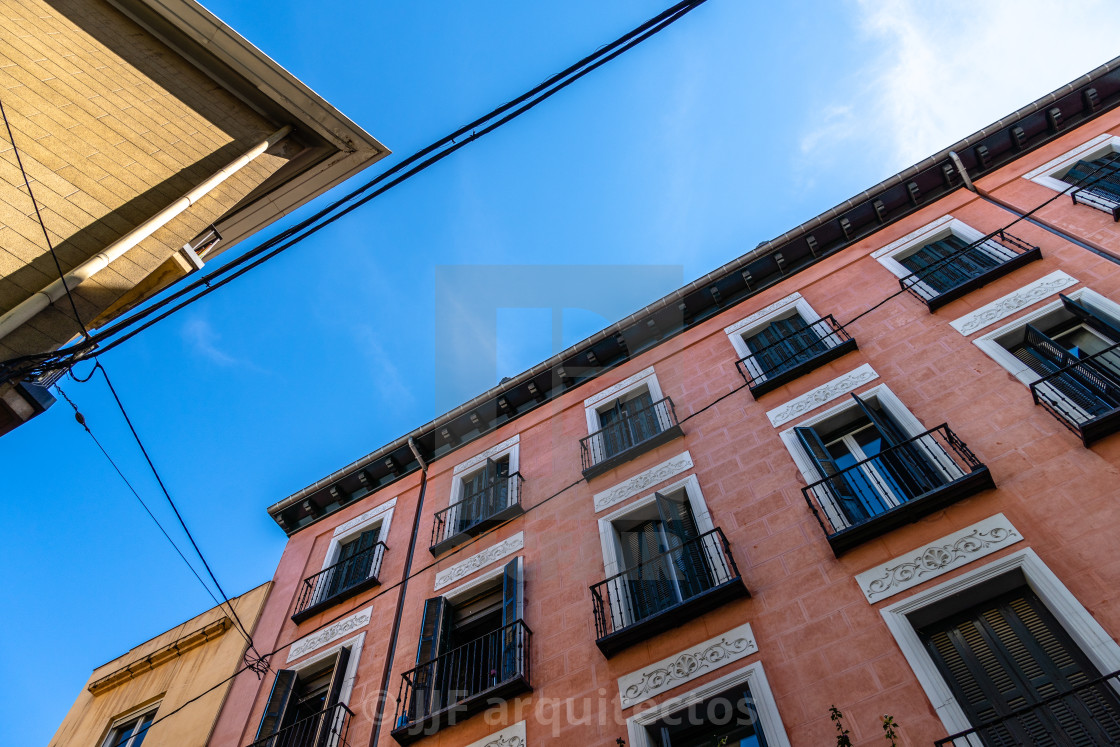 "Low angle view of old residential building in the city against sky" stock image