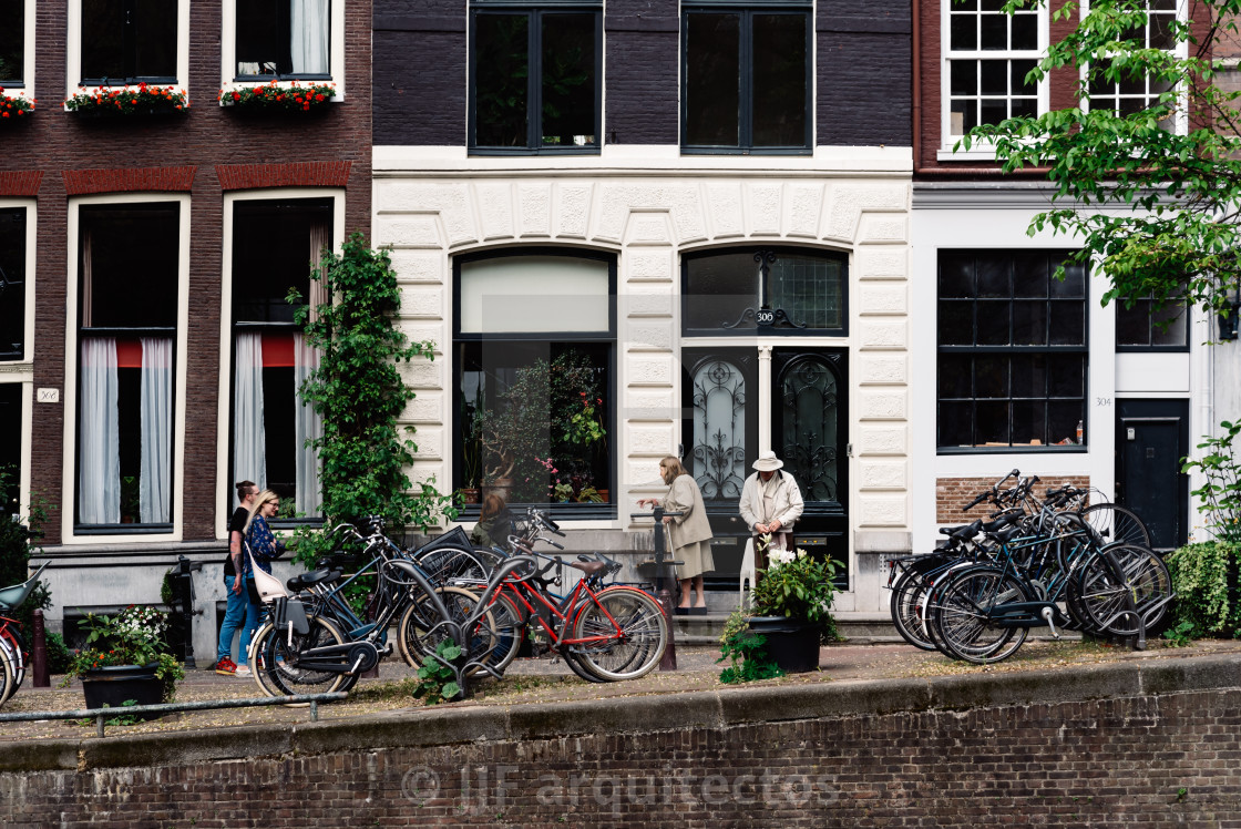 "Scenic view of the waterfront of canal with typical Dutch houses in Amsterdam" stock image