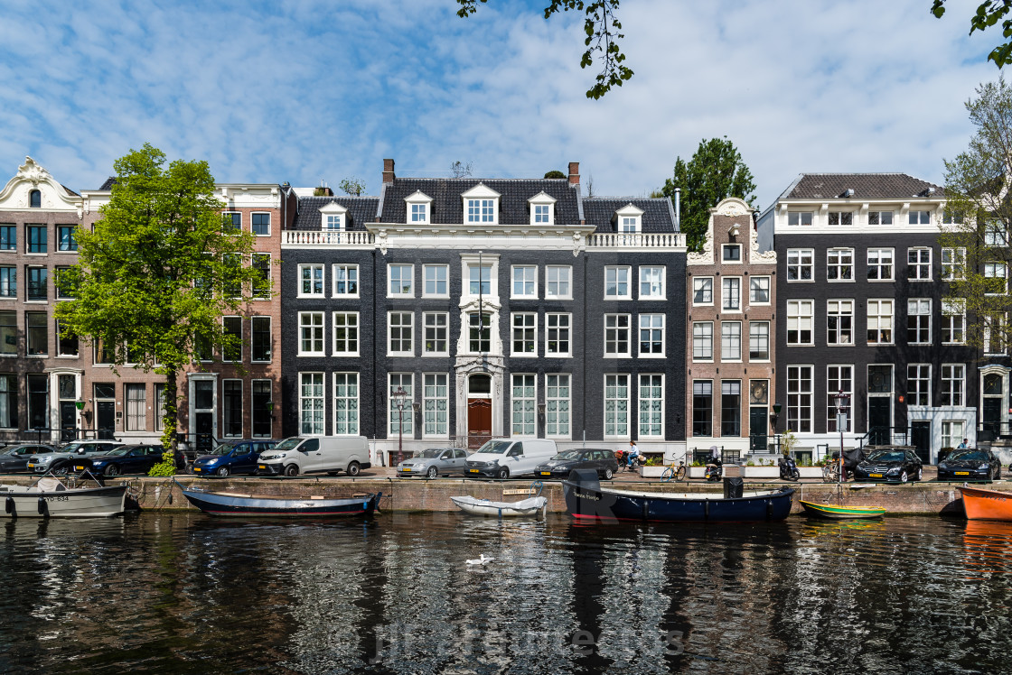 "Scenic view of the waterfront of canal with typical Dutch houses in Amsterdam" stock image