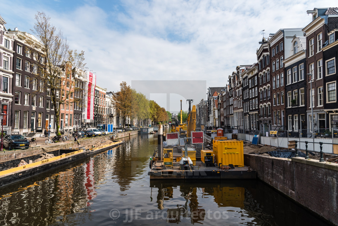 "Dredger barge carrying out maintenance and cleaning of a canal in Amsterdam" stock image