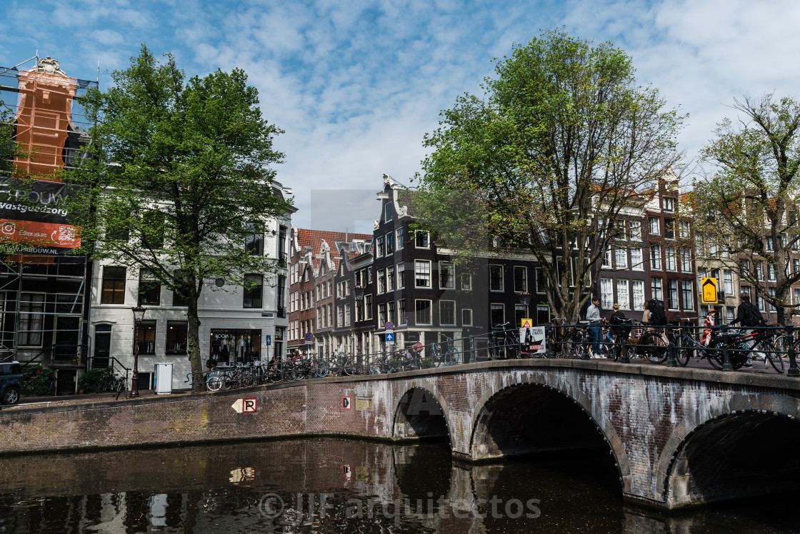 "Scenic view of the waterfront of canal with typical Dutch houses in Amsterdam" stock image