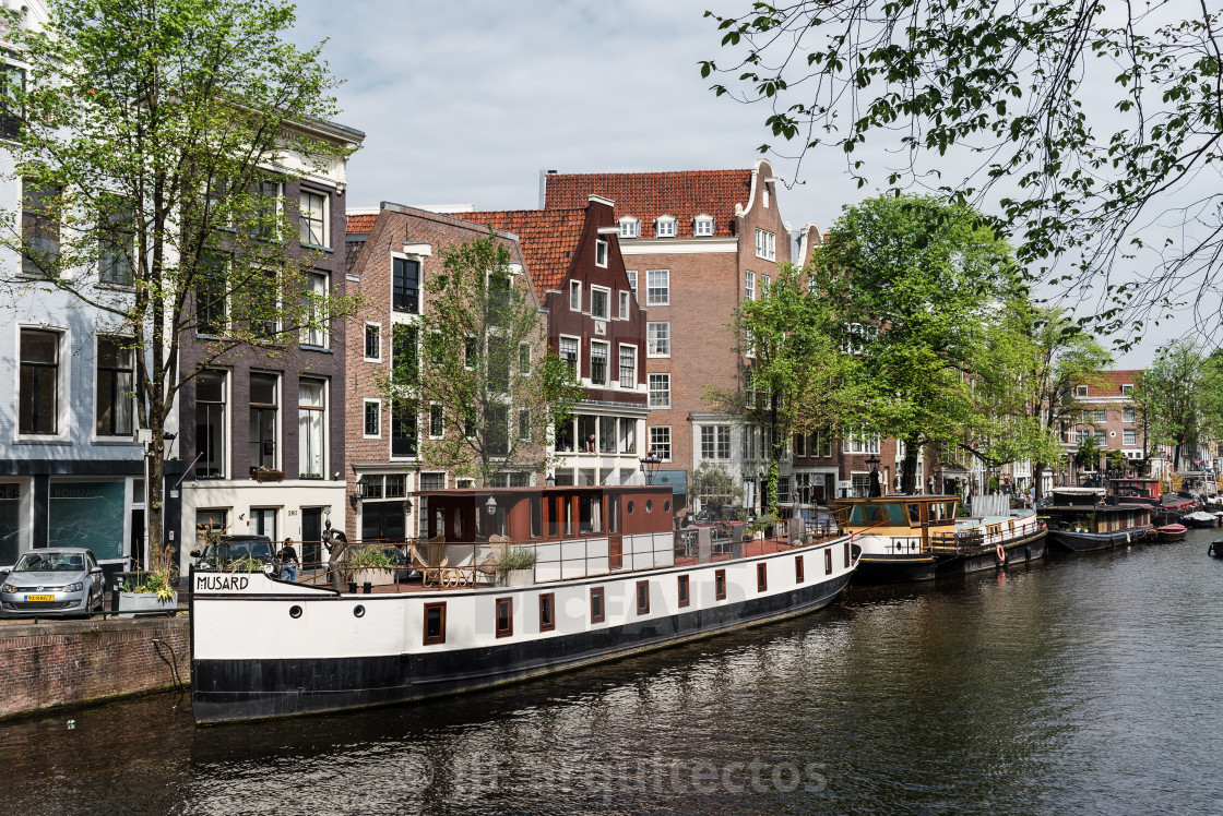 "Scenic view of the waterfront of canal with typical Dutch houses in Amsterdam" stock image