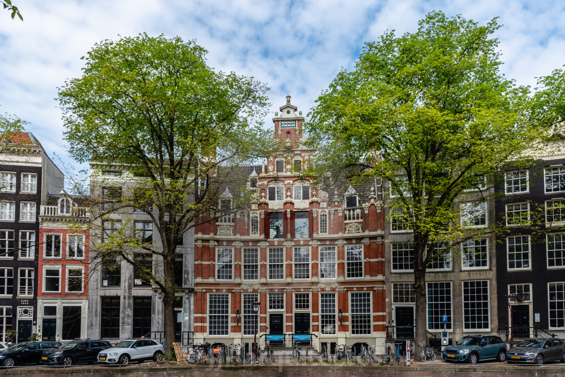 "Scenic view of the waterfront of canal with typical Dutch houses in Amsterdam" stock image