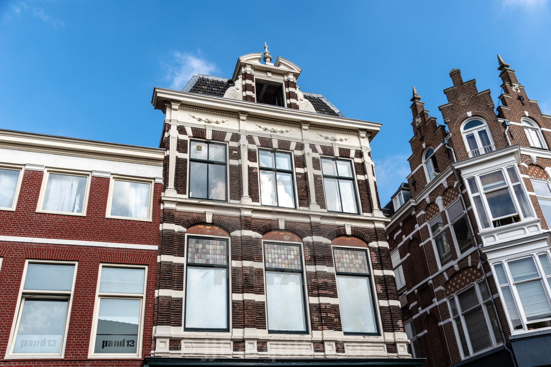 "Low angle view of traditional Dutch houses in historic centre of Haarlem" stock image