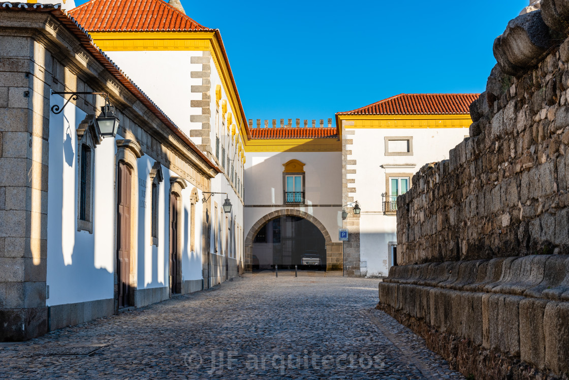 "Pousada hotel convent in the old town of Evora with buildings painted in white and yellow and ceramic tiled roofs" stock image