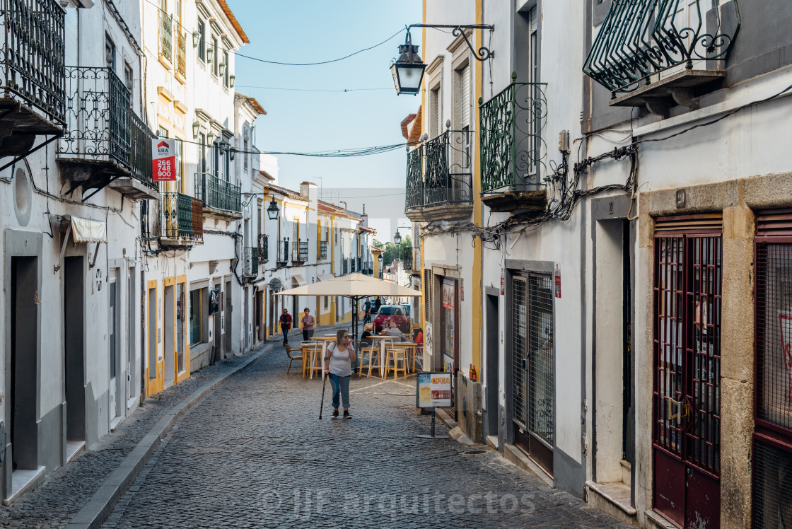 "Street in the old town of Evora with typical whitewashed houses with balconies" stock image