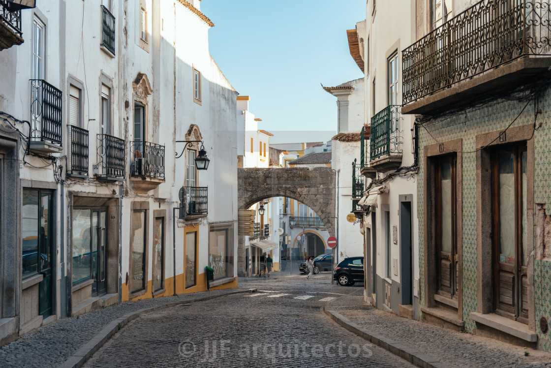 "Street in the old town of Evora with typical whitewashed houses with balconies" stock image