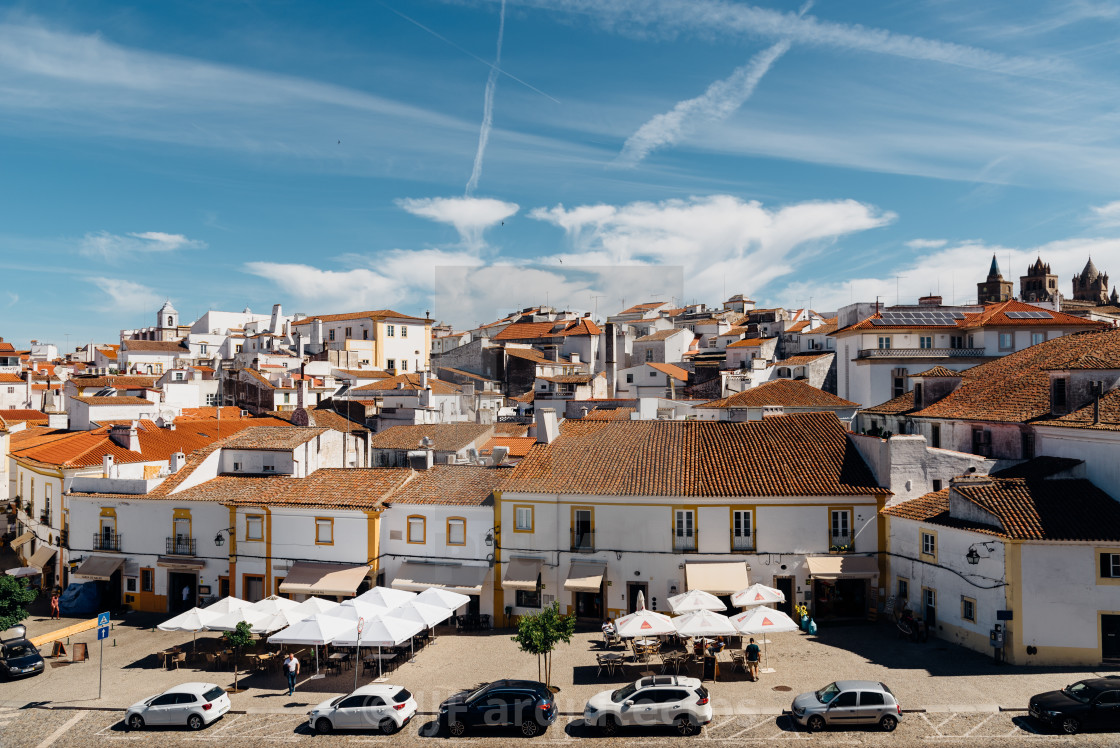 "Cityscape of Evora with typical houses painted in white and ceramic tiled roofs" stock image