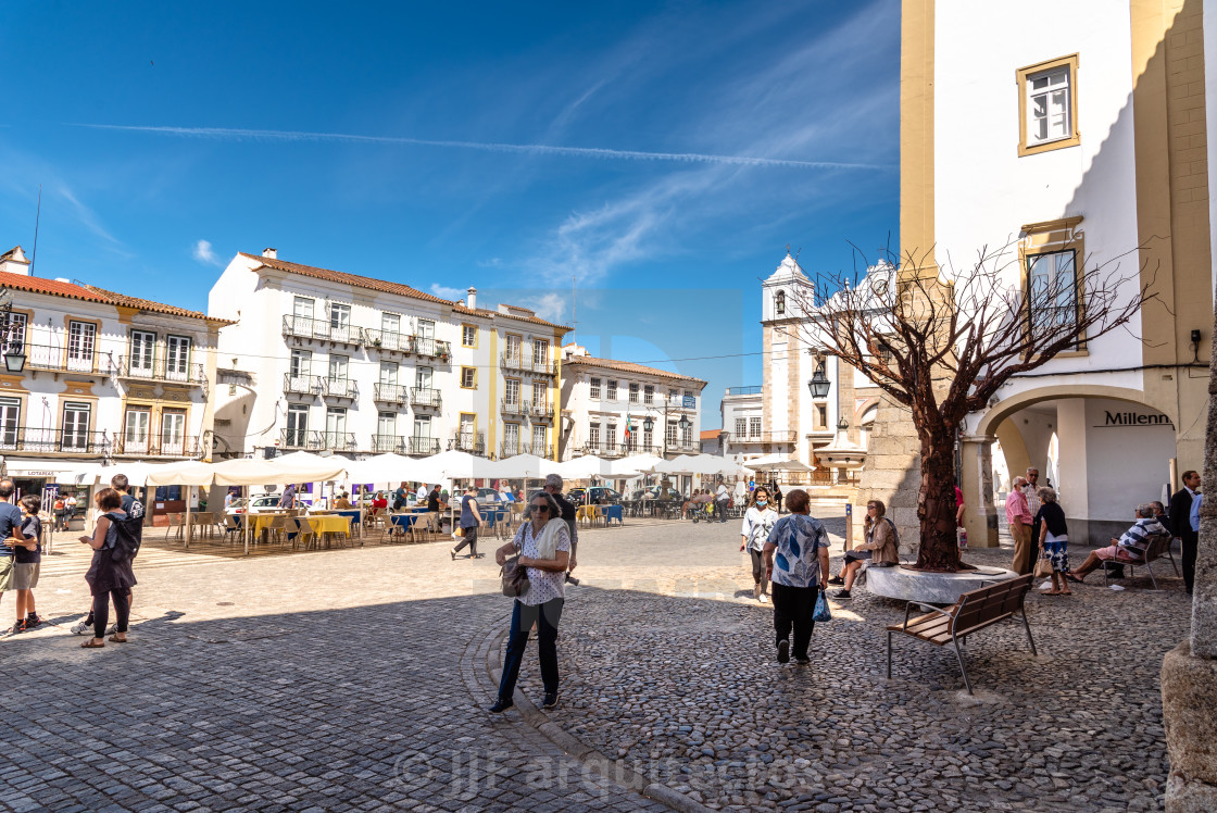 "People at terraces and restaurants of Giraldo Square in the town centre of Evora" stock image