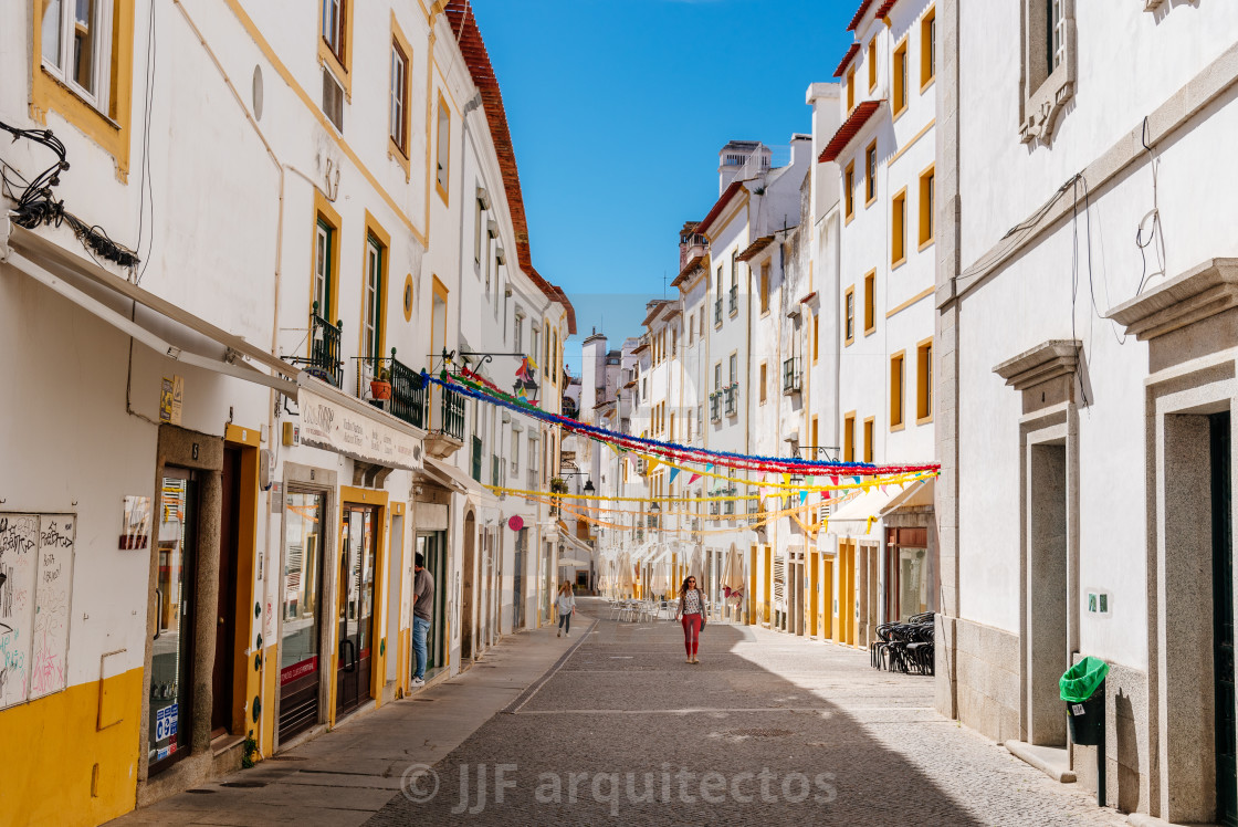 "Street in the old town of Evora with typical whitewashed houses with balconies" stock image