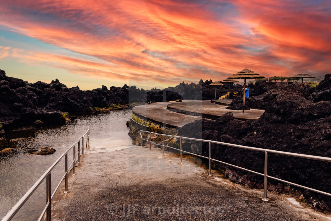 "Natural pools at Biscoitos during a dramatic sunset in the coast of Terceira Island" stock image