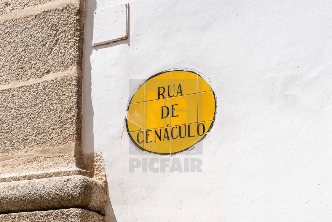 "Rua de Cenaculo or Cenaculo Street sign on whitewashed wall in Evora" stock image