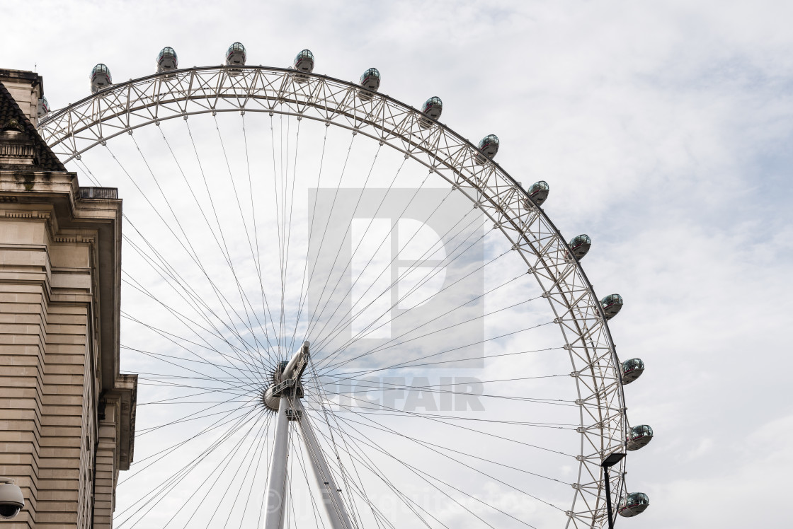 "The London Eye against cloudy sky in London" stock image