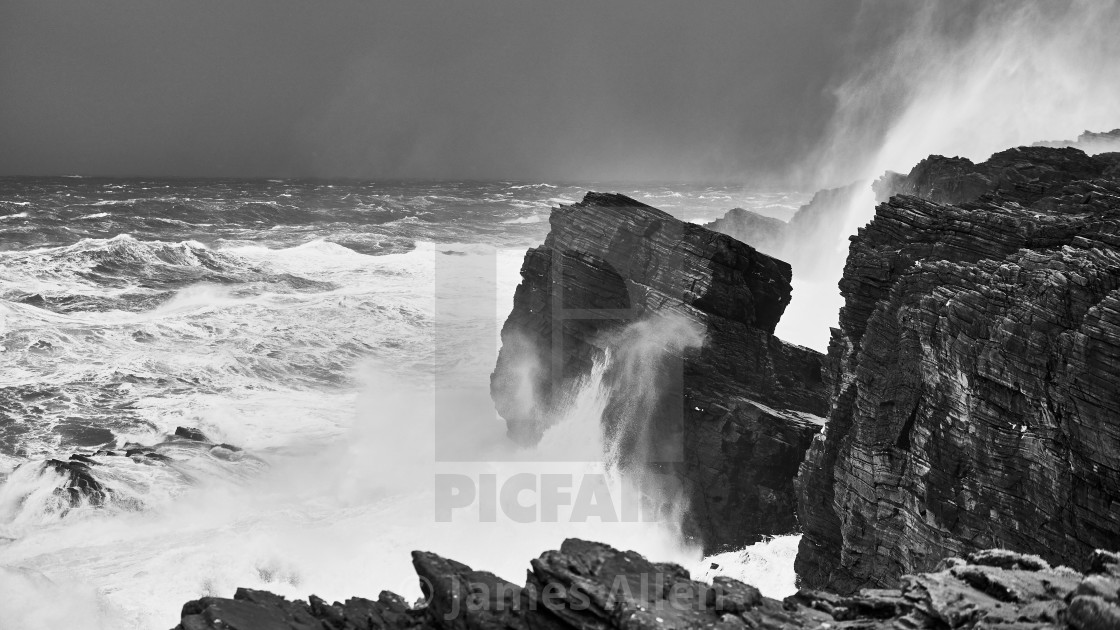 "Dún na mBó, waves hitting the cliffs" stock image