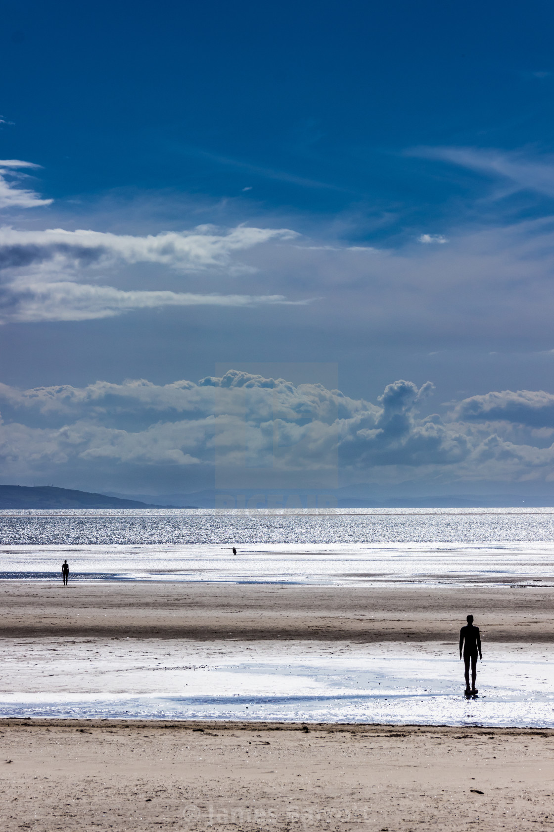 "Anthony Gormley statues on Crosby beach" stock image