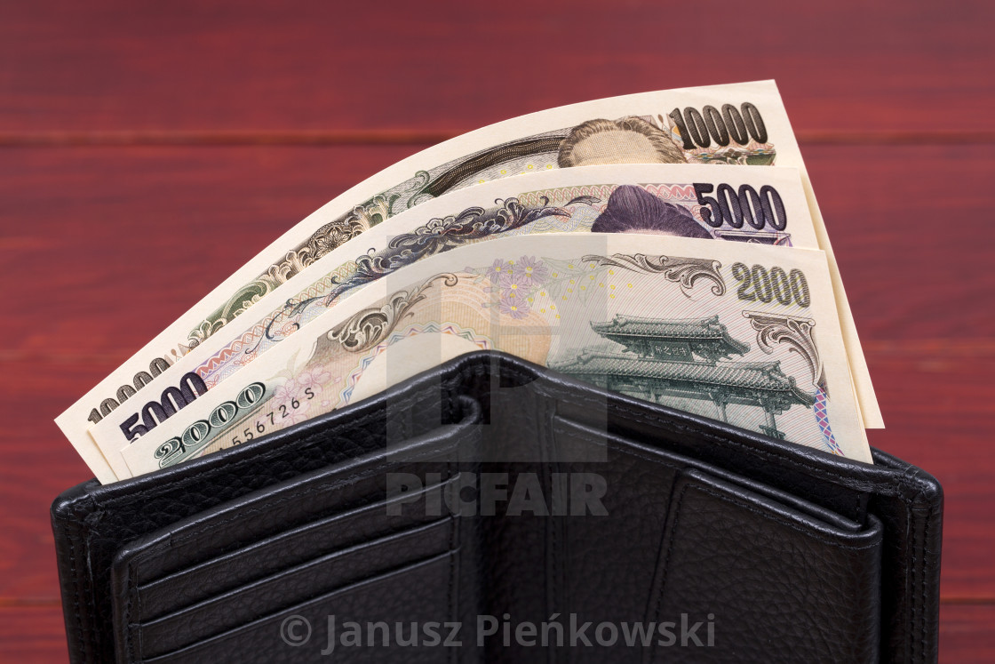 "Japanese money - yen in the black wallet" stock image