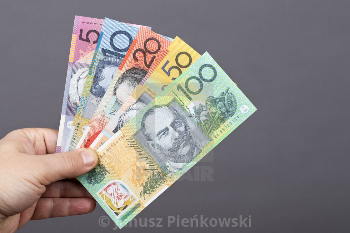 "Australian money in the hand on a gray background" stock image