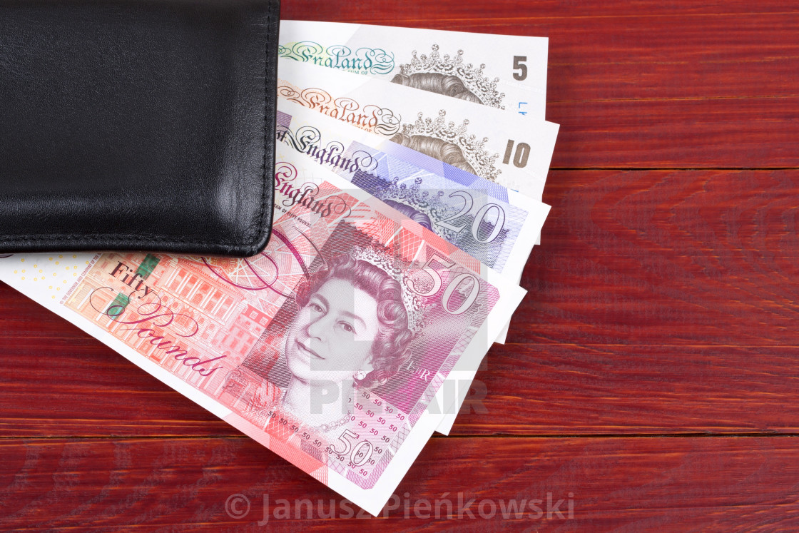 "British Pounds in the black wallet" stock image