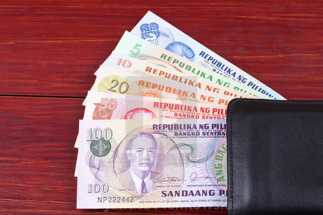 "Old Philippine peso in the black wallet" stock image