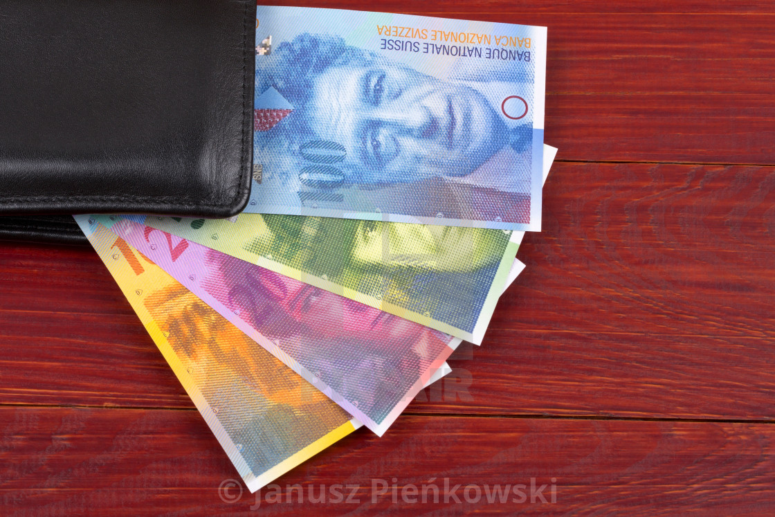 "Swiss money in the black wallet" stock image