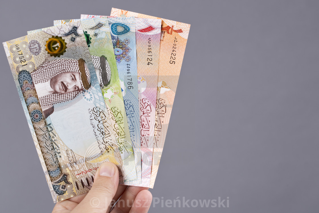 "Bahraini money in the hand on a gray background" stock image