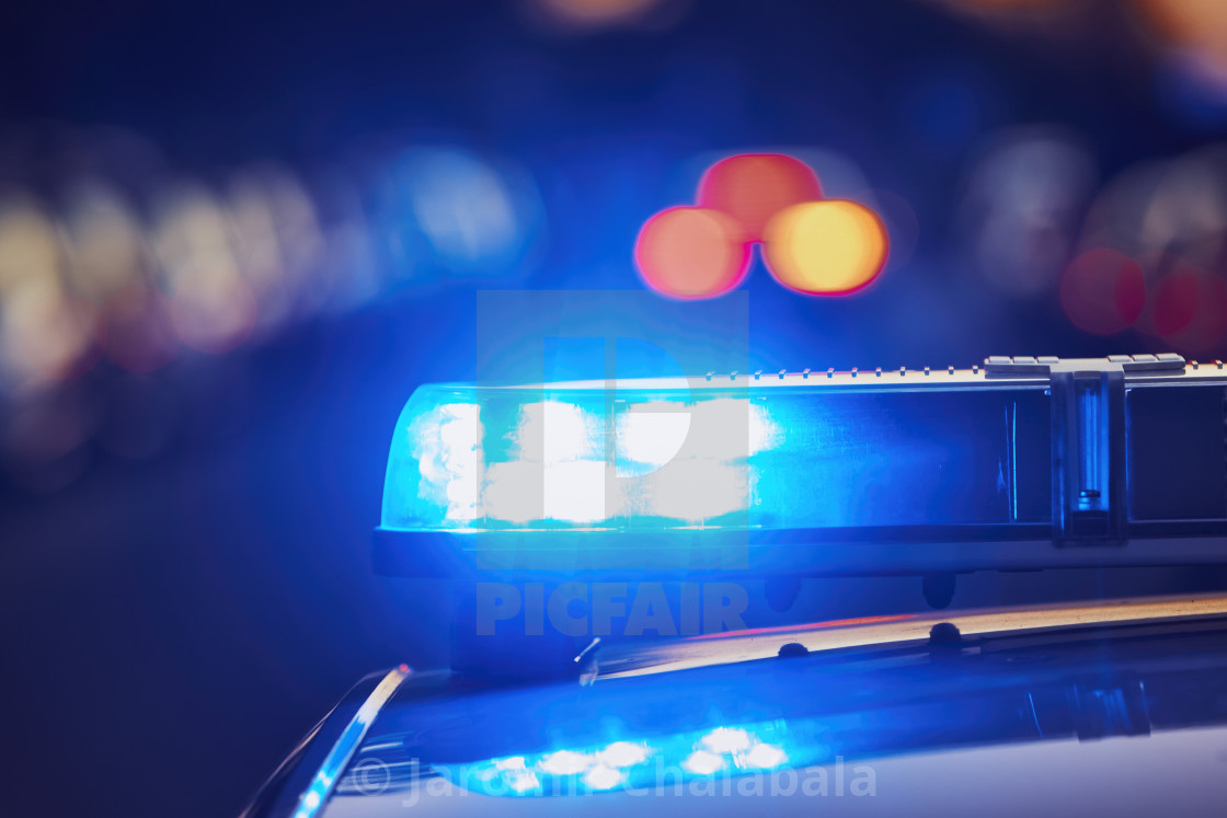 "Siren light on roof of police car" stock image