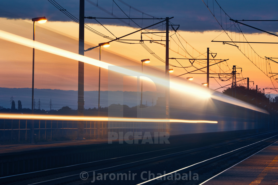 "Light trails of passenger train" stock image