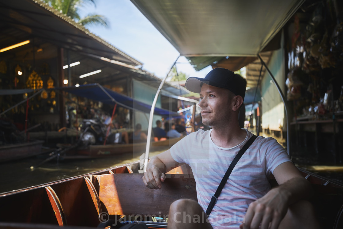 "Tourist enjoys trip to floating market" stock image