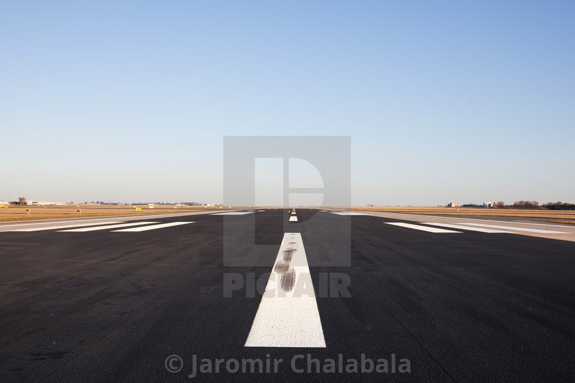 "Surface and marking of long airport runway" stock image