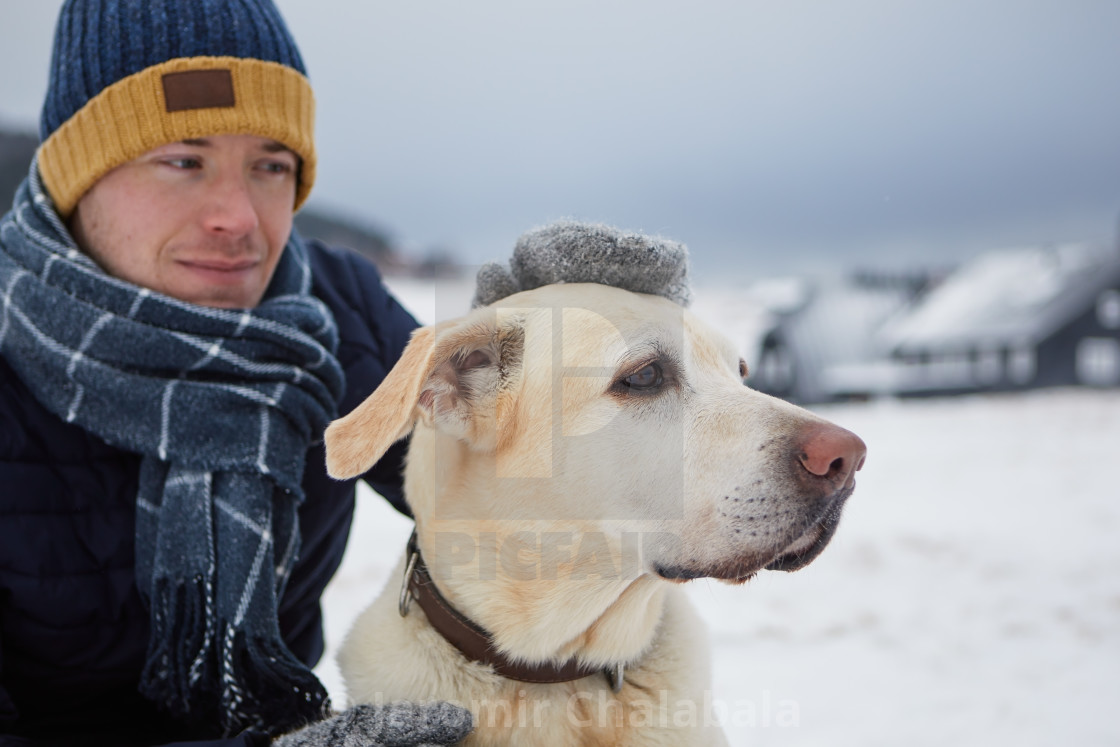 "Man with dog during frosty winter day" stock image