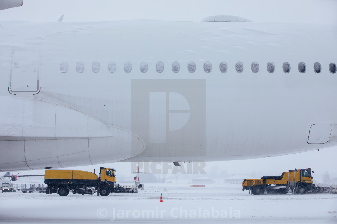 "Winter frosty day at airport during heavy snowfall" stock image