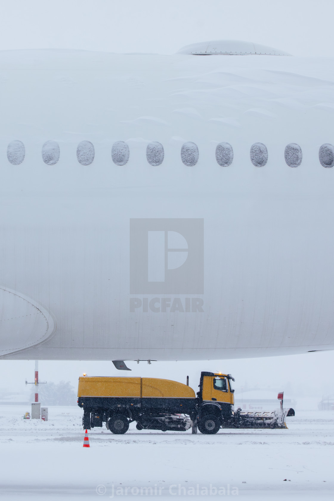 "Winter frosty day at airport during heavy snowfall" stock image