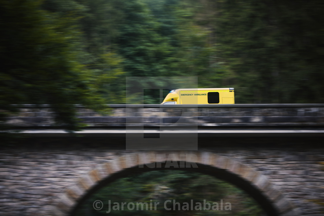 "Ambulance car of emergency medical service in blurred motion" stock image