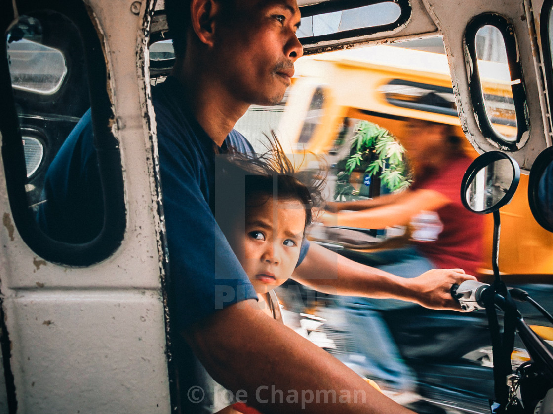 "Trike taxi driver with child" stock image