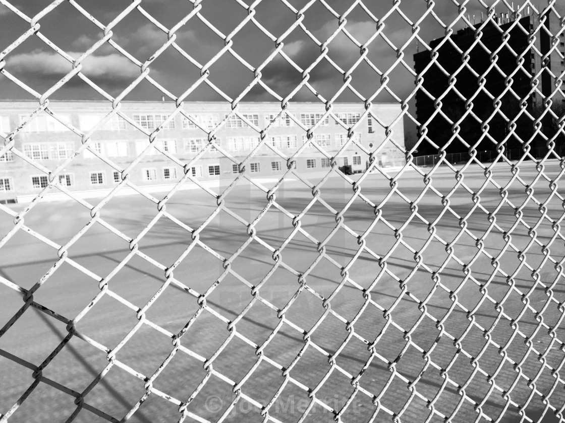 "school yard, or prison yard…?" stock image