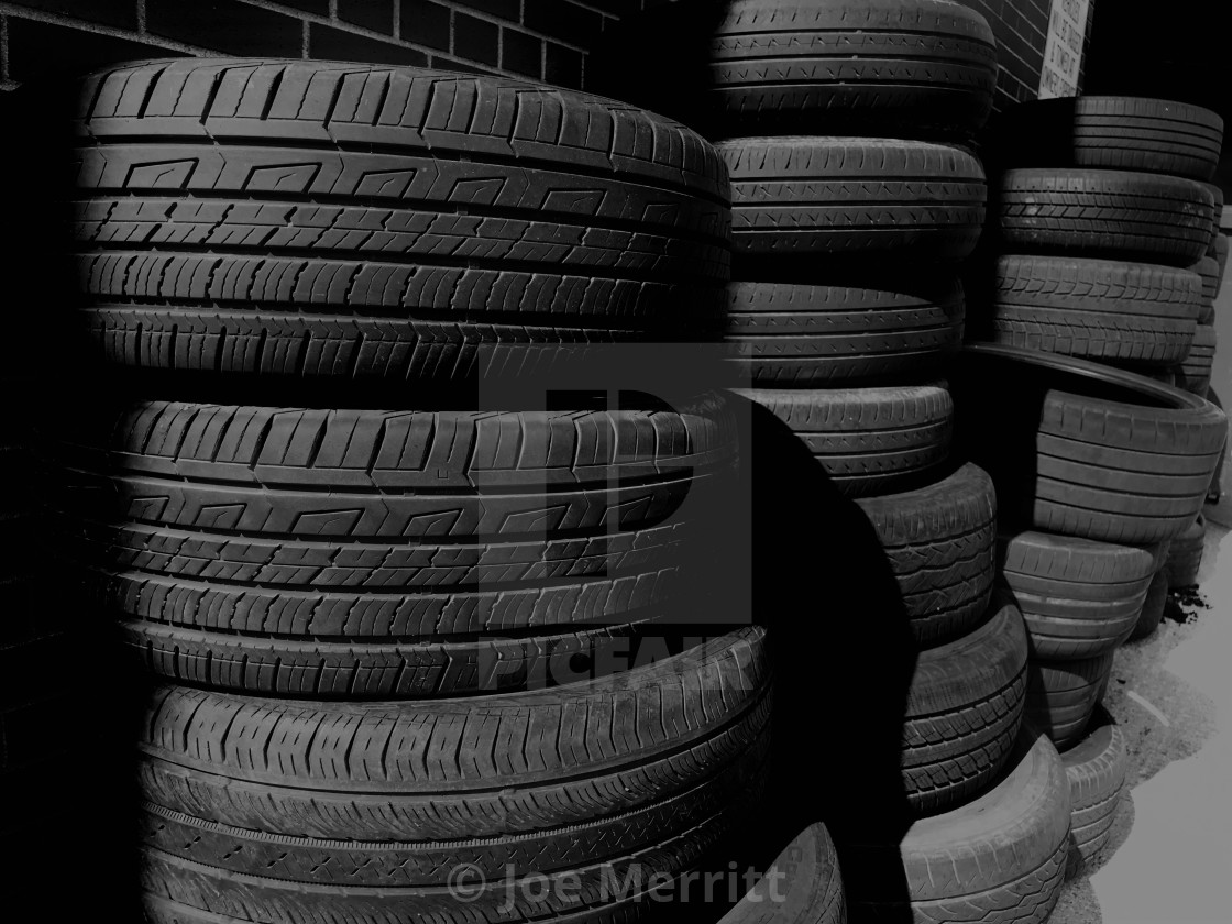 "The road behind is littered with used tires..." stock image