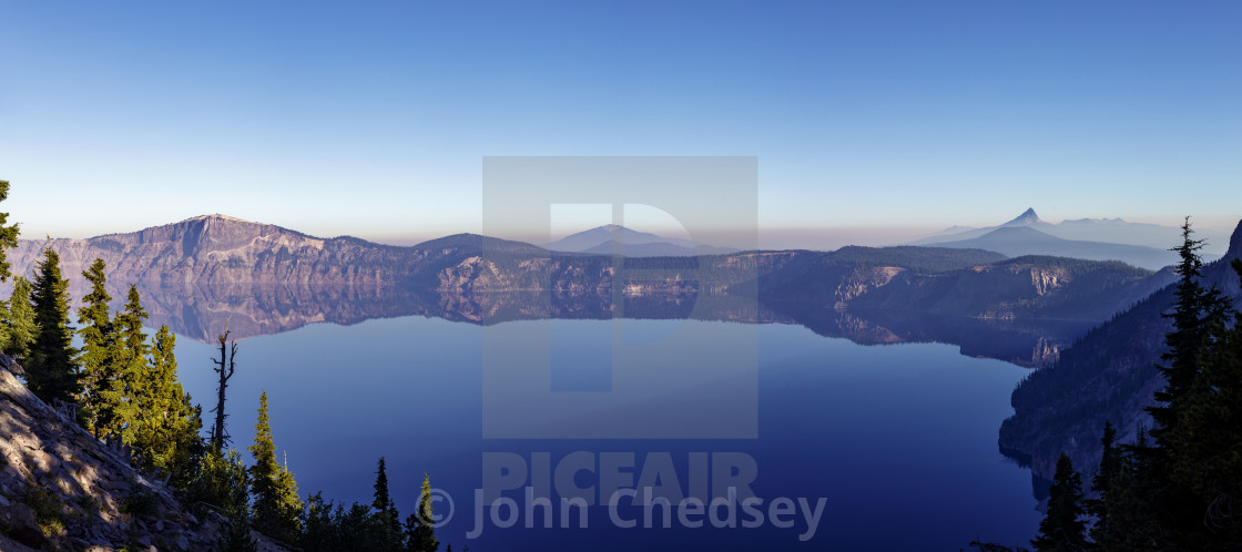 "Panoramic View of Crater Lake with Oregon Wildfire Smoke Visible on Horizon" by John Chedsey - $14.80 "Panoramic View of Crater Lake with Oregon Wildfire Smoke Visible on Horizon" stock image