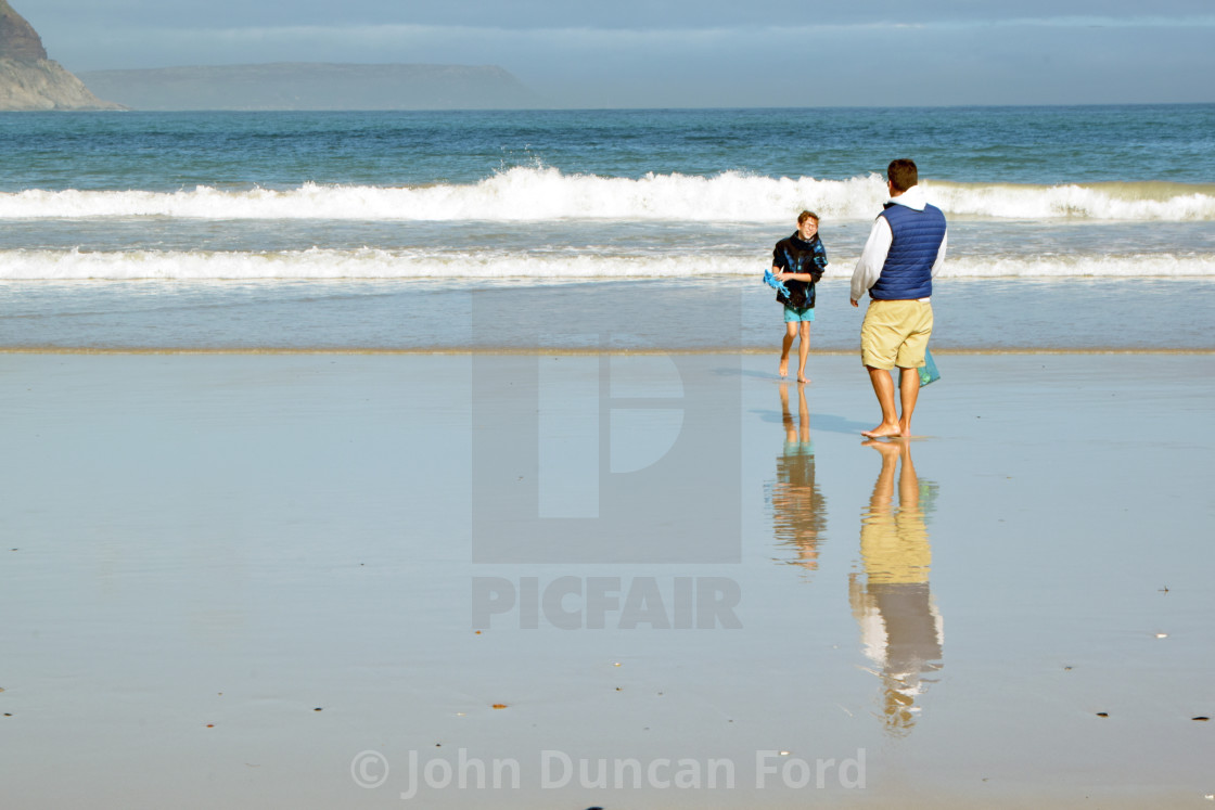 "Reflected father and son" stock image