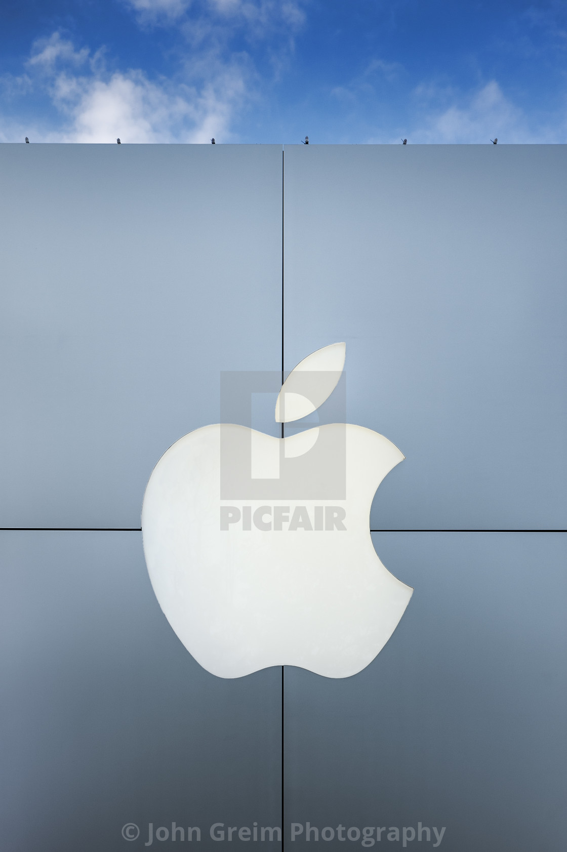 "Exterior of an Apple Store with logo." stock image