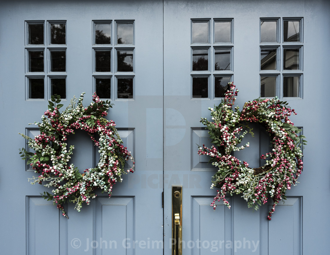 "Rural door with decorative Christmas wreaths" stock image