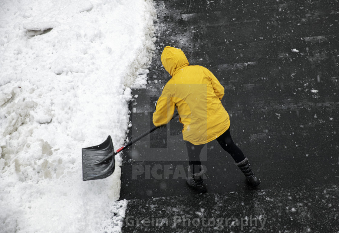 "Shoveling driveway after a snow storm" stock image